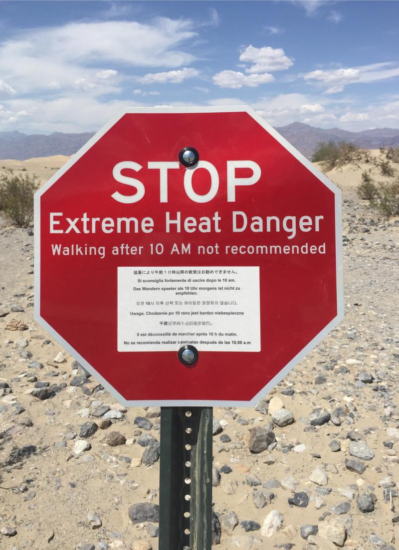 Warning sign about extreme heat in death valley. High air temperature in combination with solar radiation can become deadly with even light physical activity.